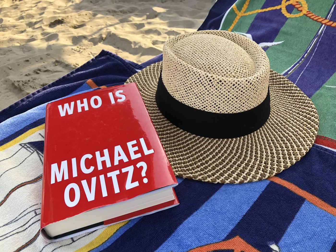 Who Is Michael Ovitz? beside a straw Panama hat